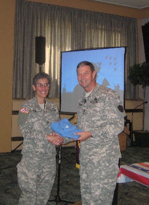 Col. Michelle Fraley, USA, outgoing chapter president, thanks Lt. Gen. Carroll F. Pollett, USA, director, Defense Information Systems Agency (DISA), and commander, Joint Task Force-Global Network Operations, for speaking at the chapter's August meeting.